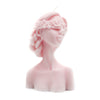 Blindfolded woman pillar candle pink