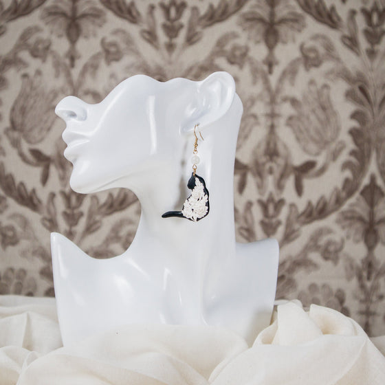 white florals on black cat polymer clay earrings with moonstone dangles model