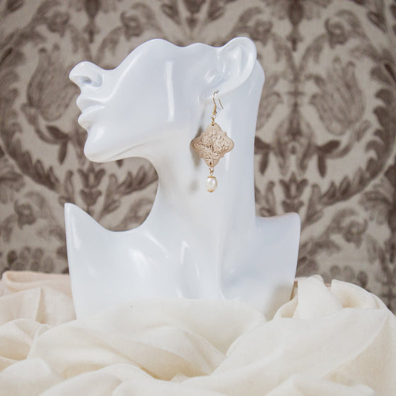 rose bush on beige polymer clay earrings with freshwater pearl dangles monochromatic model