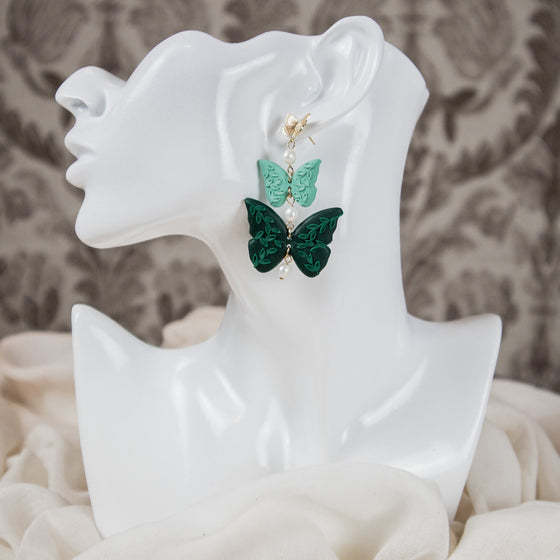 florals on shades of green butterflies polymer clay earrings with freshwater pearls dangles monochromatic model