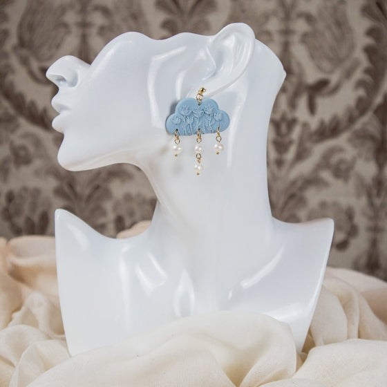 hellebore floral on pale blue cloud polymer clay earrings with freshwater pearls dangles monochromatic model