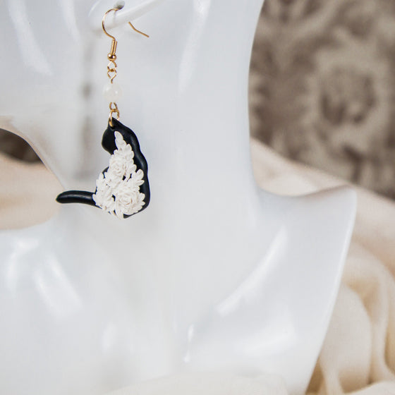 white florals on black cat polymer clay earrings with moonstone dangles