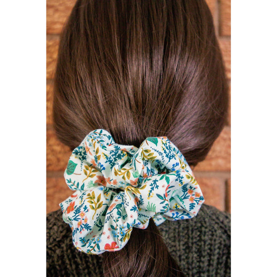 big scrunchie mint with florals on hair