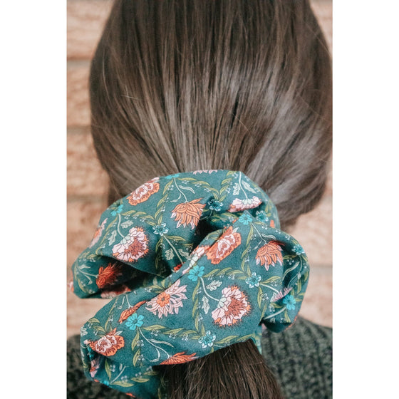 big scrunchie dark green with florals Liberty of London on hair