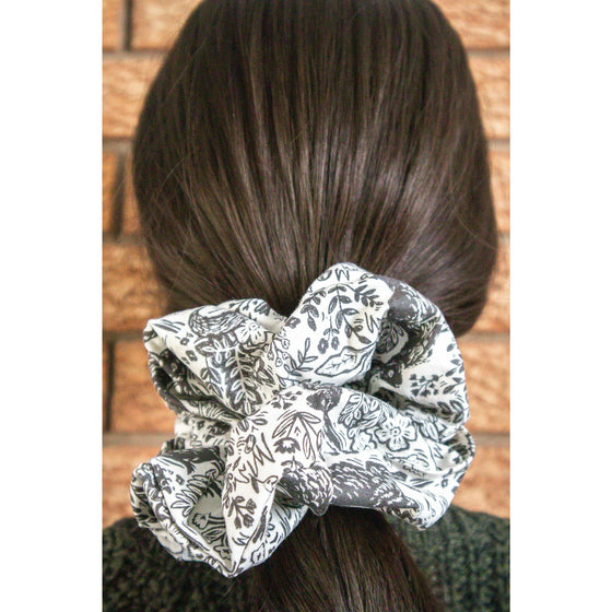 big scrunchie white with black fairy-tale motifs on hair