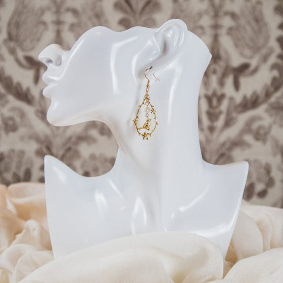 bird and freshwater pearl vignette earrings dangles model