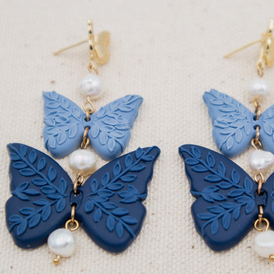 florals on shades of blue butterflies polymer clay earrings with freshwater pearls dangles monochromatic