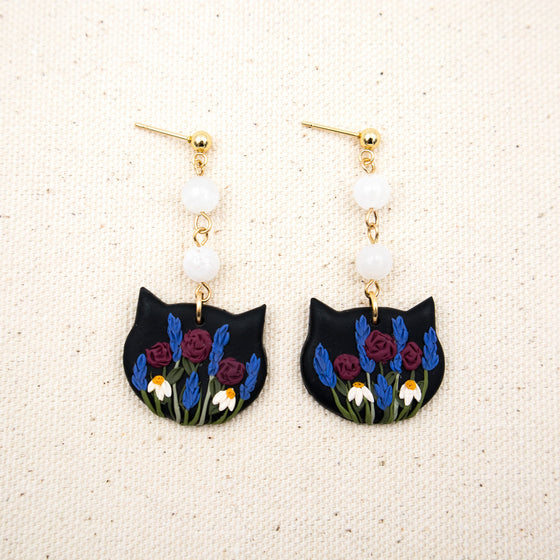 florals on black cat face polymer clay earrings with moonstones dangles