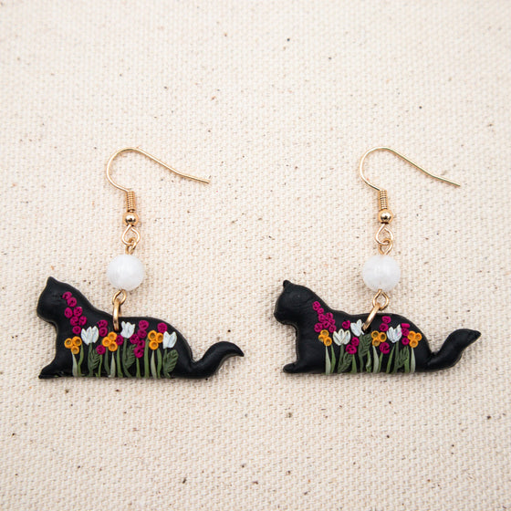 florals on black cat polymer clay earrings with moonstone dangles