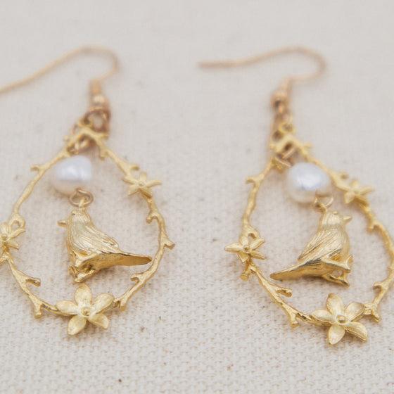 bird and freshwater pearl vignette earrings dangles