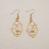 bird and freshwater pearl vignette earrings dangles