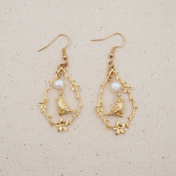 bird and freshwater pearl vignette earrings dangles