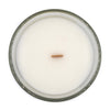 selene rose water and lily coconut apricot wax candle in a classic, clear glass votive with a wooden wick  top