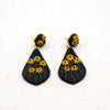 Polymer clay earrings black-eyed susan flowers on black teardrop dangles