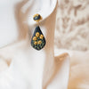 Polymer clay earrings black-eyed susan flowers on black teardrop dangles