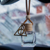 Fragranced car or locker diffuser oil housed in a clear diamond glass bottle with a wooden top, and cord butterbeer deathly hollows