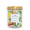 luna sweet citrus and jasmine Scoopable coconut apricot wax melt whipped into a clear glass jar with a gold lid and spoon a pleasant thought