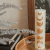 Golden Moon Phases Candle Pillar displayed