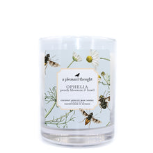  ophelia peach blossom and basil coconut apricot wax candle in a classic, clear glass votive with a wooden wick a pleasant thought