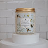 ophelia peach blossom and basil Scoopable coconut apricot wax melt whipped into a clear glass jar with a gold lid and spoon