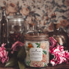 monroe plum blossom and peony Scoopable coconut apricot wax melt whipped into a clear glass jar with a gold lid and spoon notes