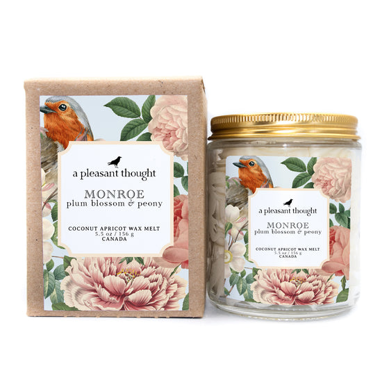 monroe plum blossom and peony Scoopable coconut apricot wax melt whipped into a clear glass jar with a gold lid and spoon box