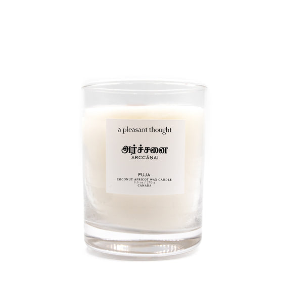 arccanai puja coconut apricot wax candle in a classic, clear glass votive with a wooden wick tamil candle a pleasant thought