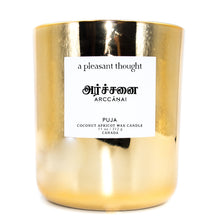  puja arccanai tamil coconut apricot wax candle in an elegant gold glass vessel with a wooden wick a pleasant thought