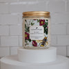 ruby raspberry and wild mint Scoopable coconut apricot wax melt whipped into a clear glass jar with a gold lid and spoon