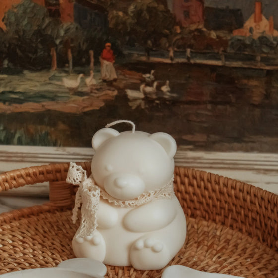 teddy bear pillar candle displayed