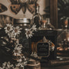tobacco vanilla gatsby black coconut apricot wax candle in a matte black glass vessel with a wooden wick a pleasant thought fragrance ingredients