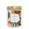 eyre wildflowers Scoopable coconut apricot wax melt whipped into a clear glass jar with a gold lid and spoon a pleasant thought