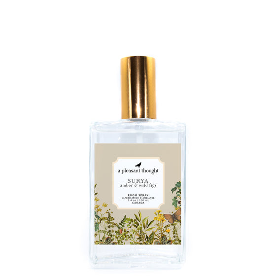 surya amber and wild figs Fragranced room and linen spray housed in a decorative glass bottle with a gold lid  a pleasant thought
