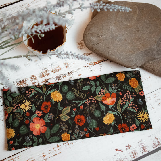 black and floral eye pillow display