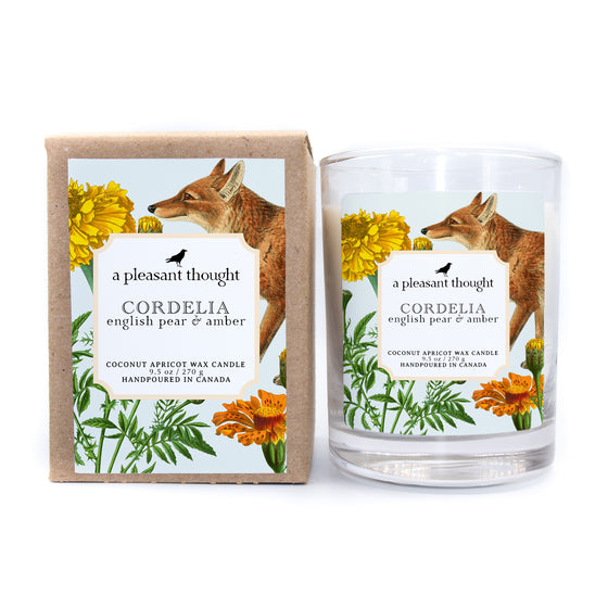 cordelia english pear & amber coconut apricot wax candle in a classic, clear glass votive with a wooden wick box