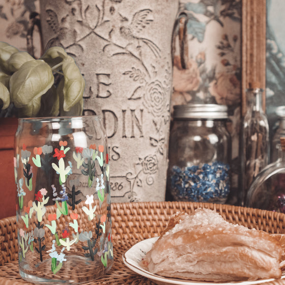 handpainted floral stems on a beer can glass display