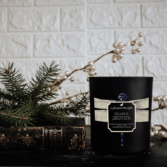 night blooming jasmine and sea air pearle black coconut apricot wax candle a pleasant thought displayed