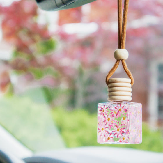 handpainted pink daisies car diffuser in use