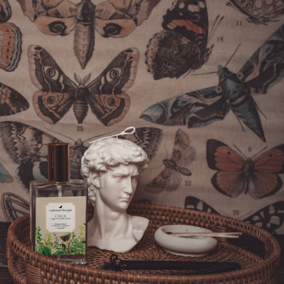 circe sage and wild mint Fragranced room and linen spray housed in a decorative glass bottle with a gold lid display