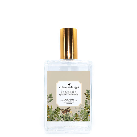 samsara spiced sandalwood Fragranced room and linen spray housed in a decorative glass bottle with a gold lid a pleasant thought