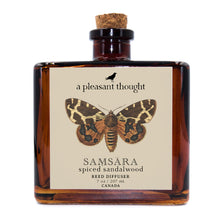  samsara spiced sandalwood Fragranced diffuser oil housed in an amber glass, apothecary bottle with rattan reeds a pleasant thought