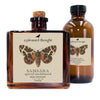 samsara spiced sandalwood Fragranced diffuser oil housed in an amber glass, apothecary bottle with rattan reeds  package